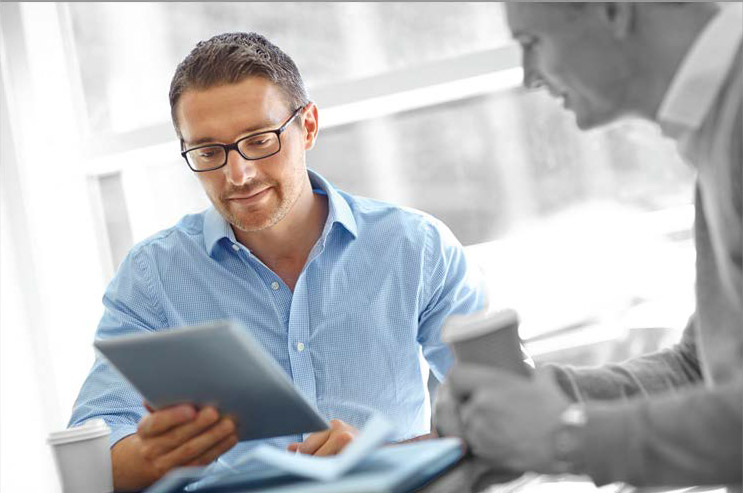 Analysis Paperwork a man holding a tablet