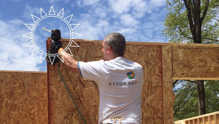 social_card Volunteer working to build a home.
