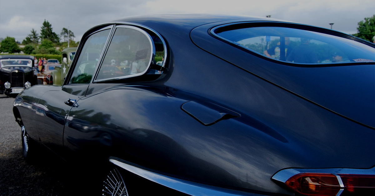 a black car parked on a road